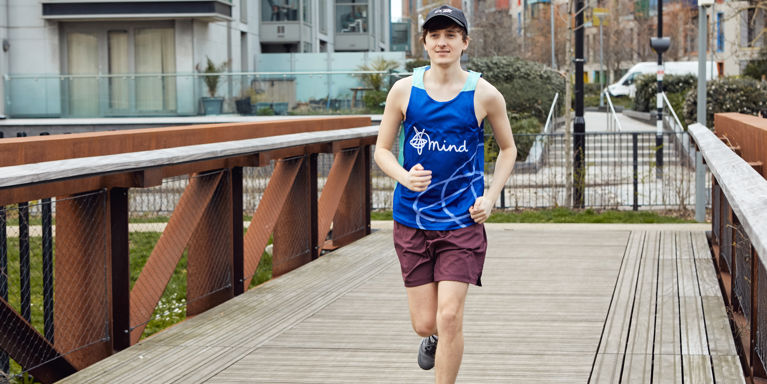 Man runs across bridge