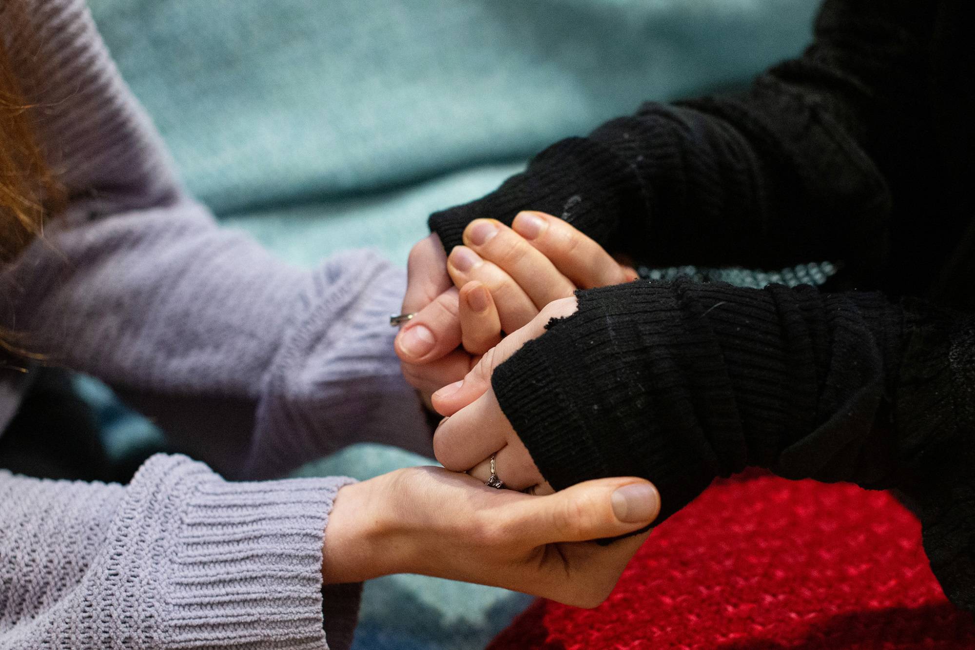 Close Up Of Two Young People Holding Hands