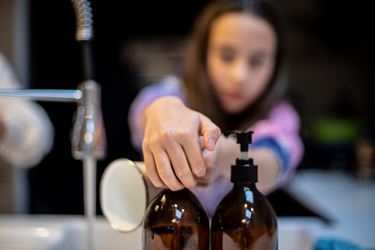 Close Up Of Person Pressing Soap To Wash Hands