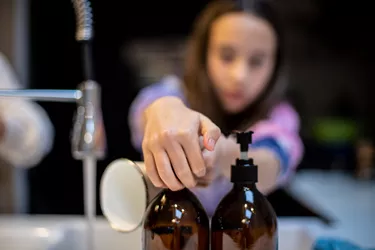 Close Up Of Person Pressing Soap To Wash Hands