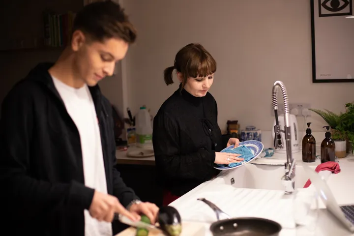 Girl Dries Dishes As Boy Chops Veg Girl Dries Dishes As Boy Chops Veg