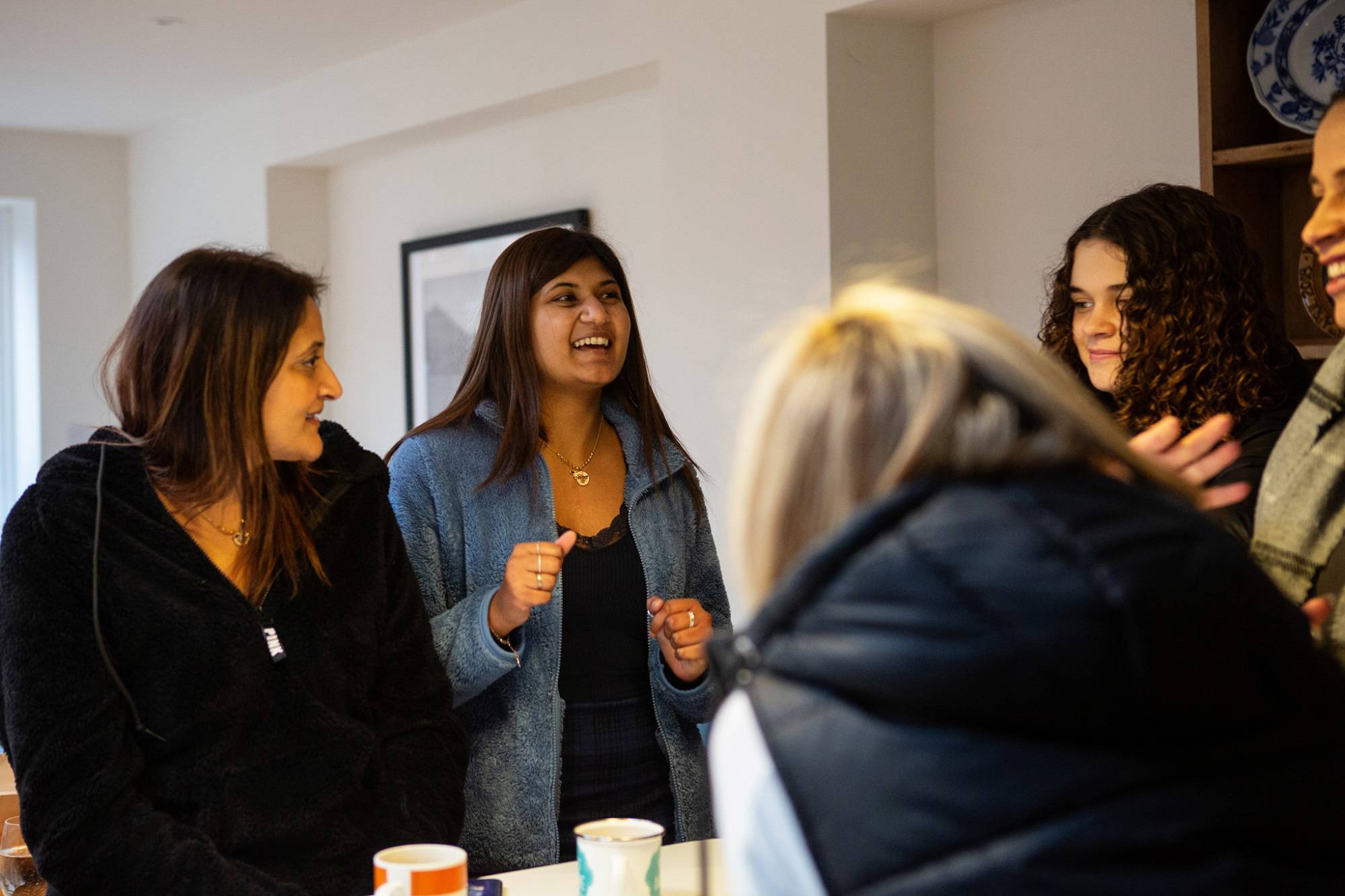 Group Of Women And Teen Girls Chatting