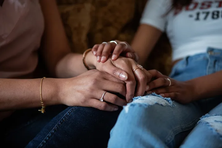Hands On Top Of Hands Being Supportive