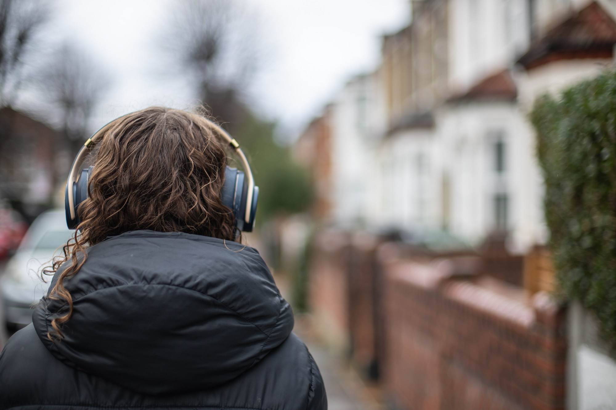 Person Wearing Headphones In Street