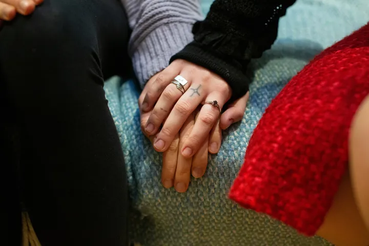 Supportive Tattooed Hand Over Other Hand Supportive Tattooed Hand Over Other Hand