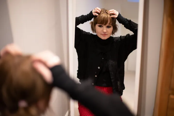 Teen Girl Doing Hair In Mirror Teen Girl Doing Hair In Mirror