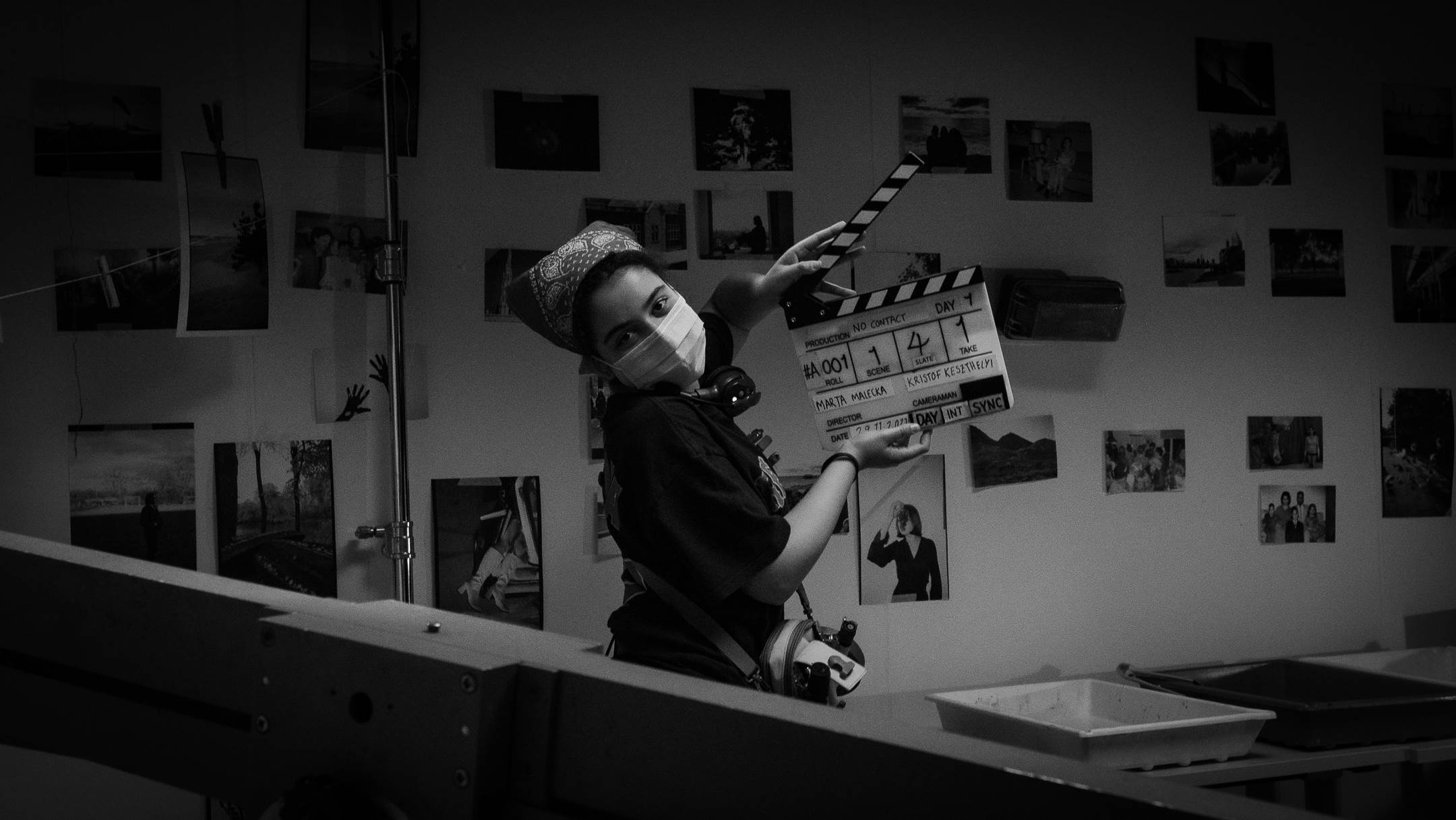 Bella is in the dark room developing her film