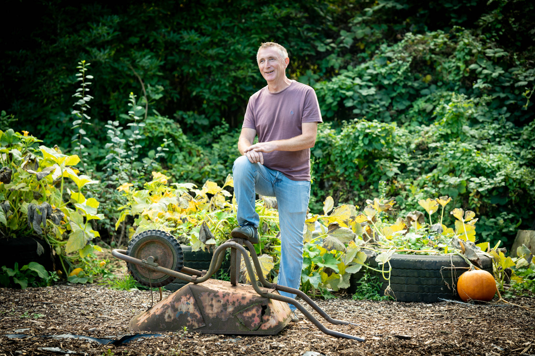 Person standing next to wheelbarrow