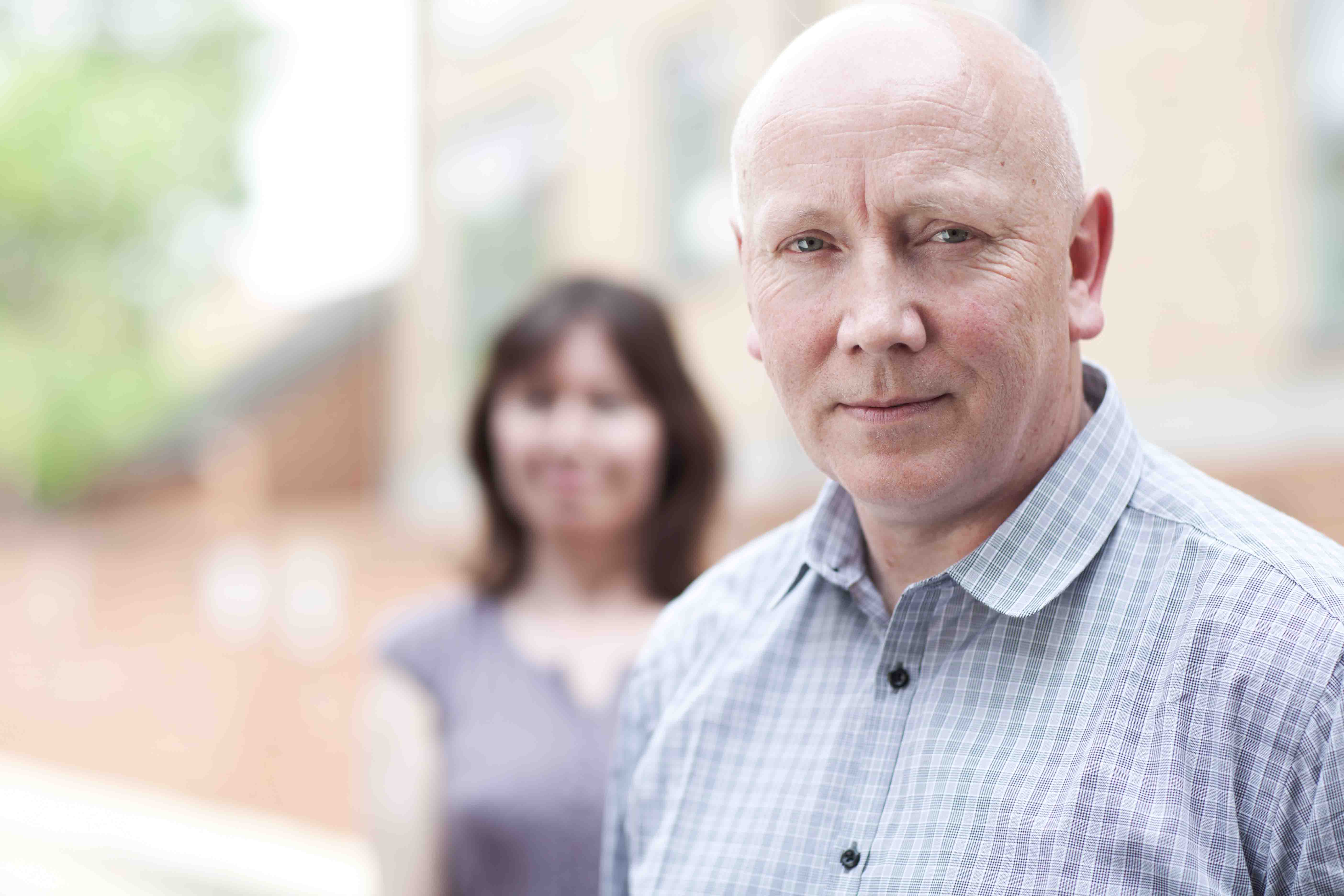 Male with female in background