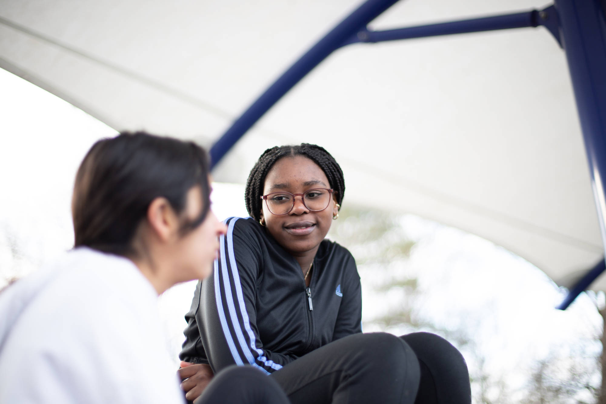 Young People Chatting In Playground