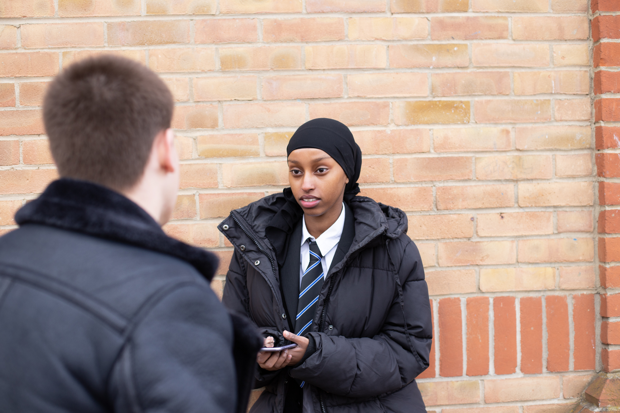 Young People Chatting Outside School