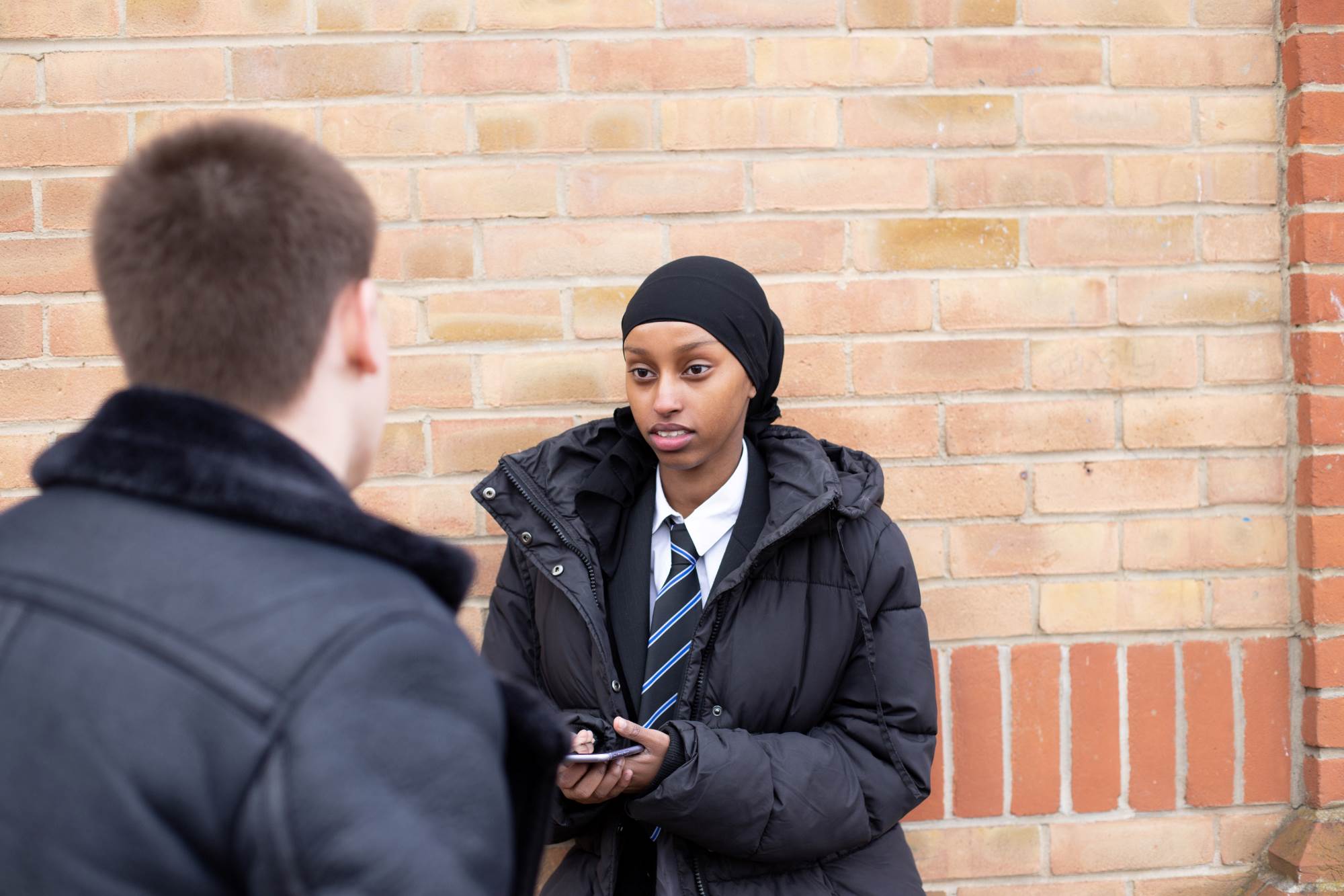 Young People Chatting Outside School