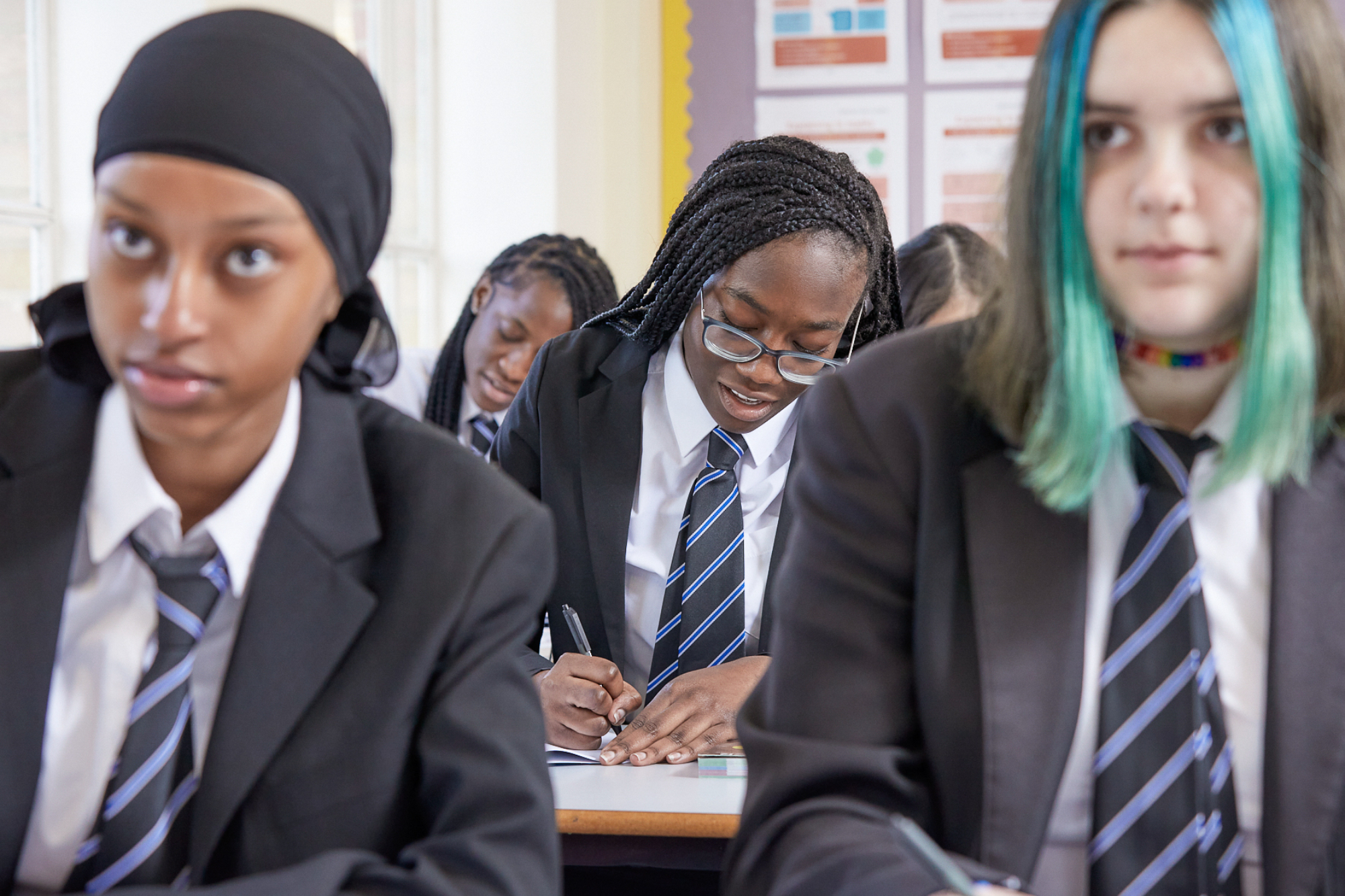 Young People Focussing In Class