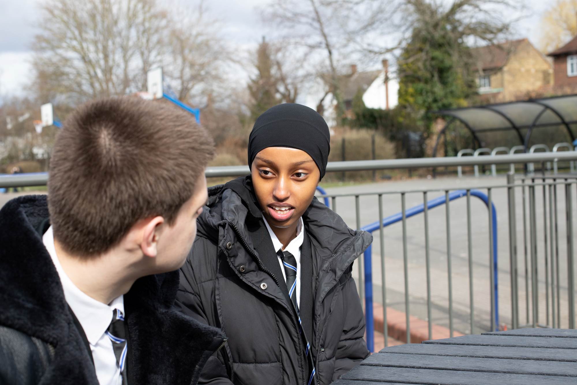 Young People Talking On School Steps