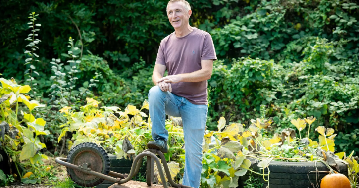 Person gardening and smiling