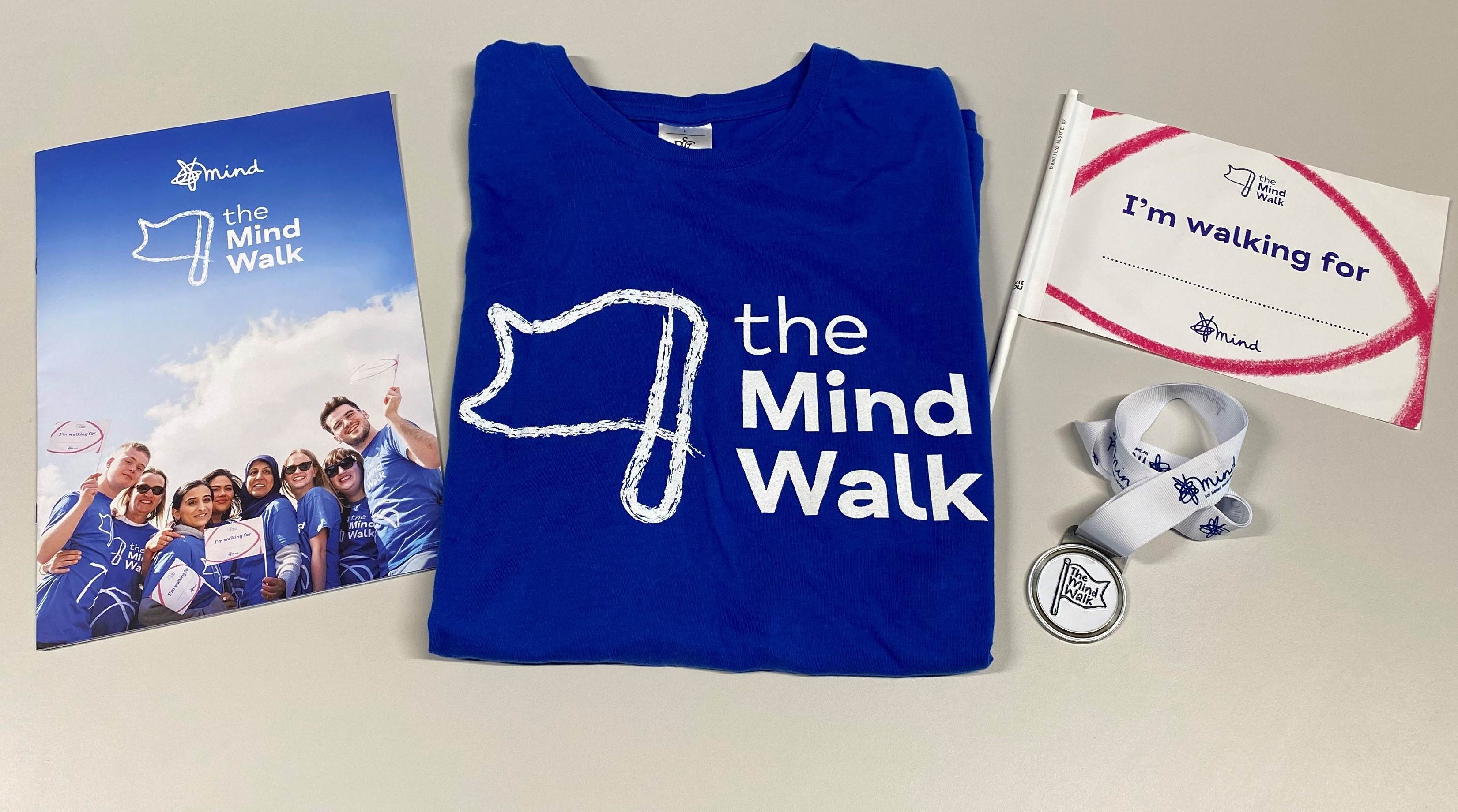 Image of a fundraising pack, t-shirt, flag and medal