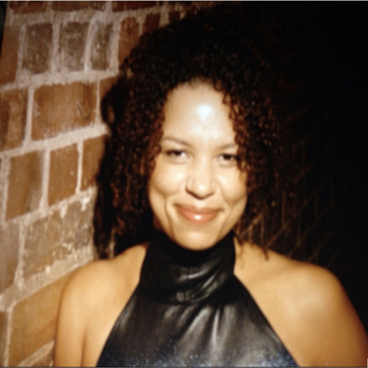 Lynette Charles smiling - Chair of Mind in London