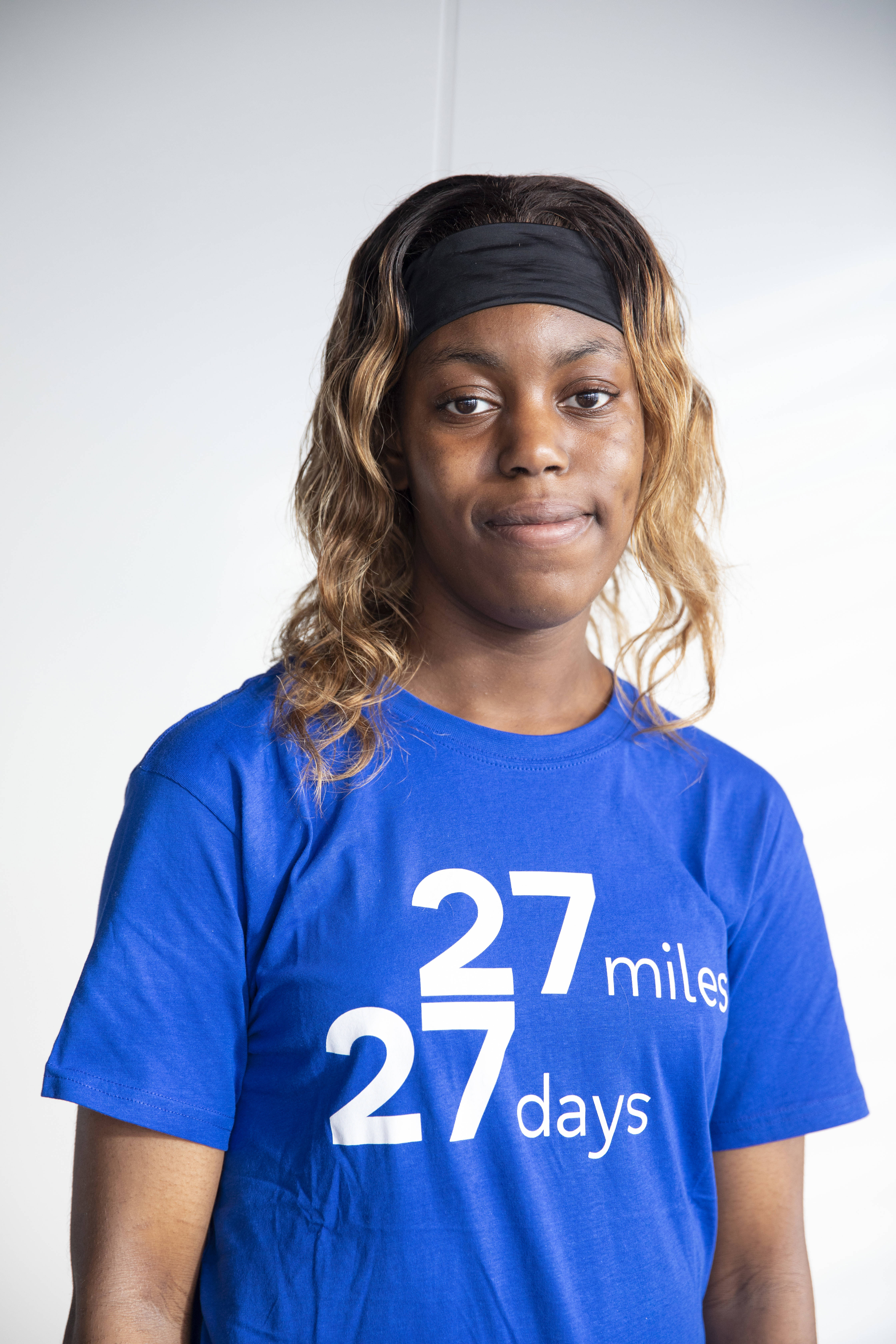 Person looking at the camera wearing a 27 27 t-shirt 