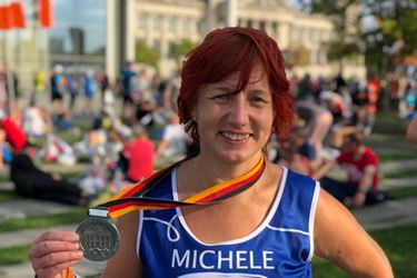 Happy lady with Berlin Marathon medal