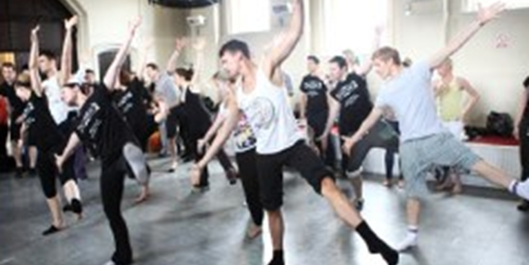 A group of dancers rehearsing