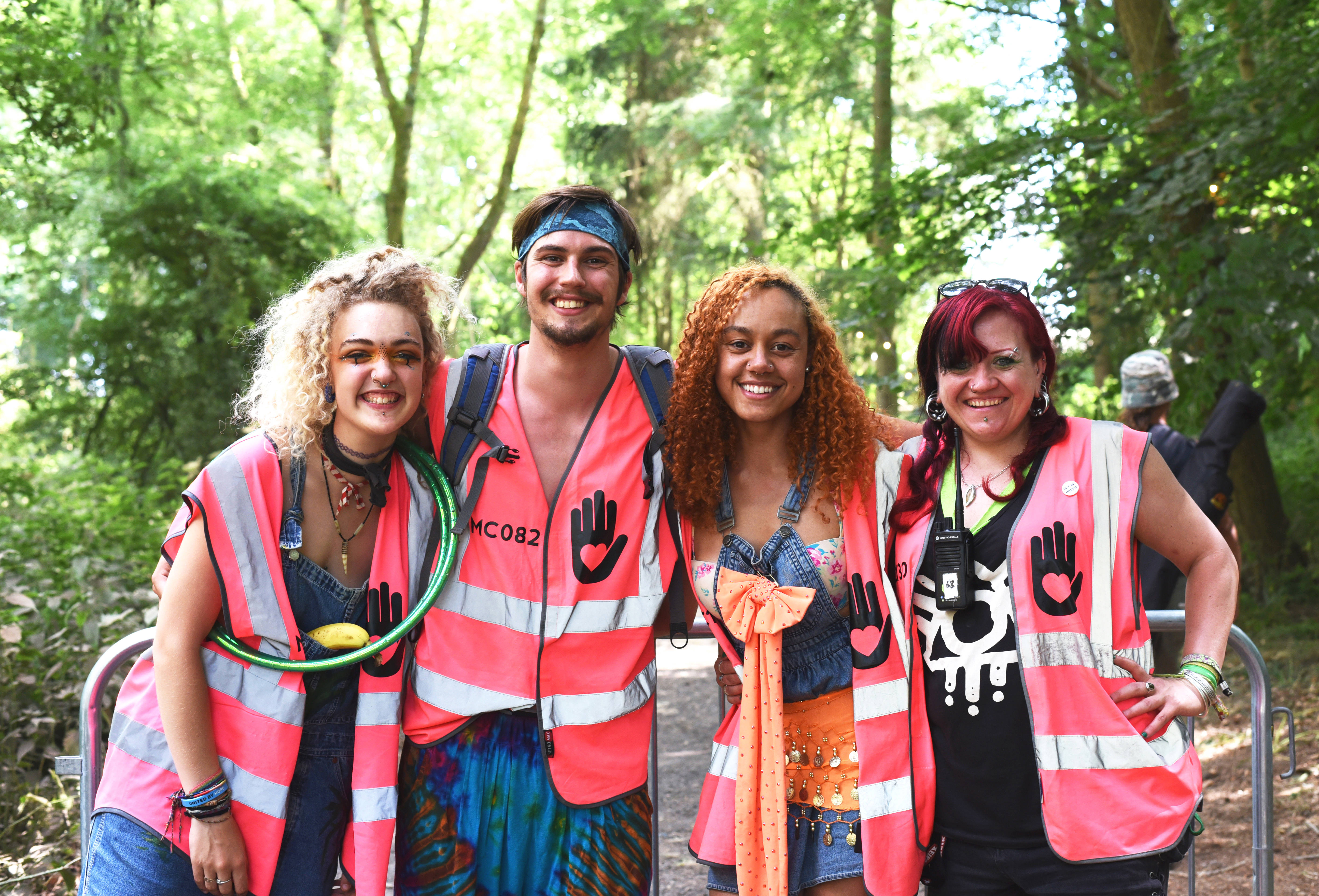 4 festival volunteers smiling