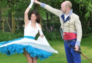 Photo of Clare smiling and dancing with her partner