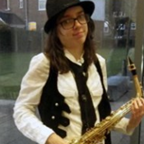 an image of a person holding a saxophone