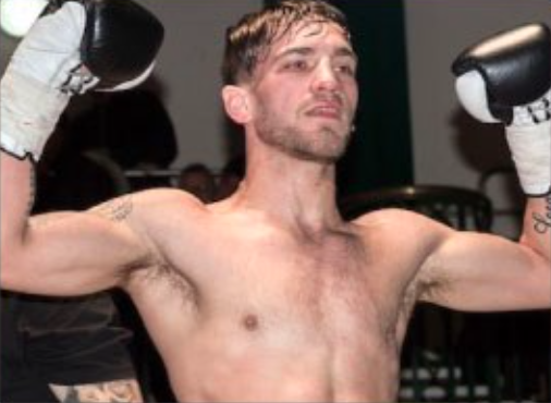 male lifting hands hands in the air, wearing boxing gloves