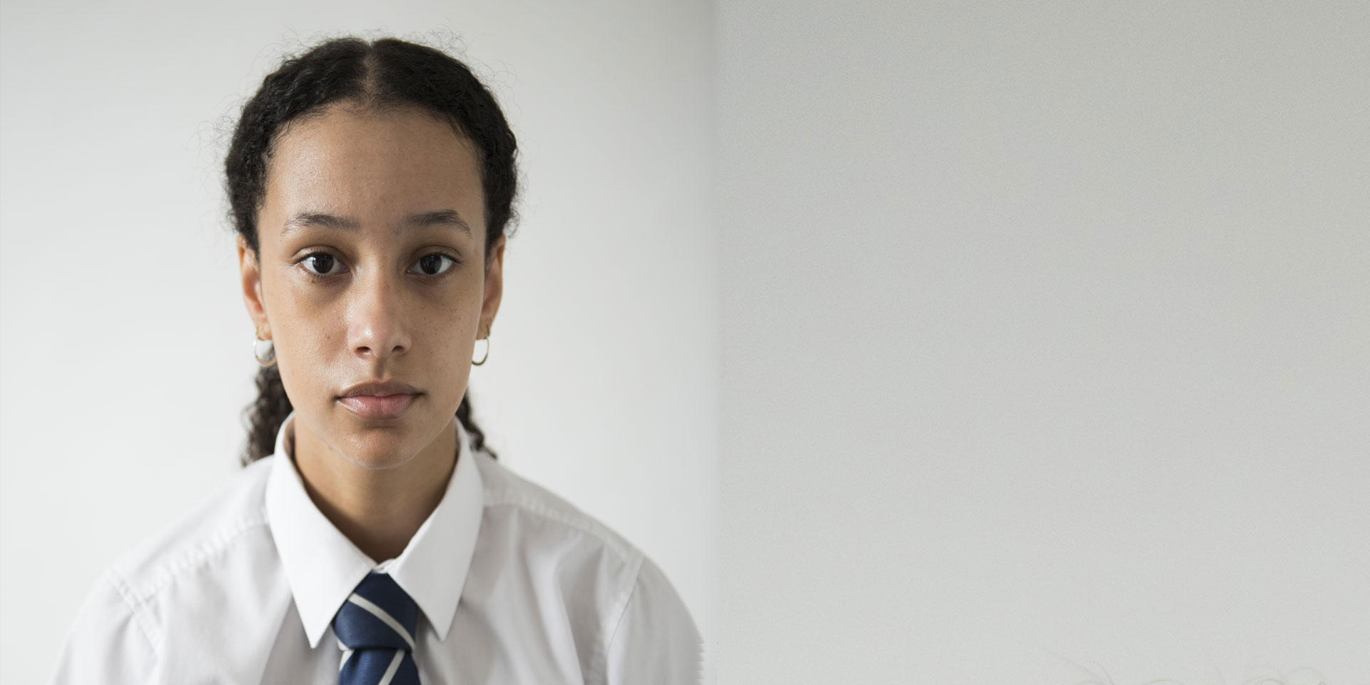 Picture of a teenage girl staring straight at the camera 