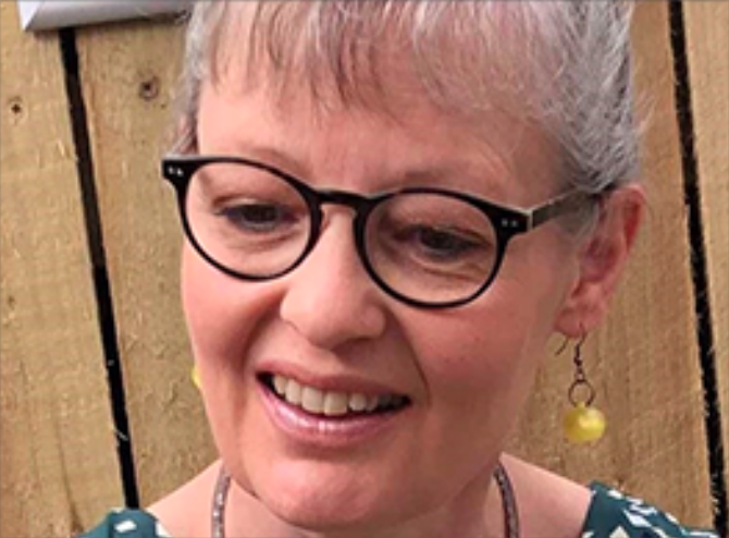 Female smiling looking down