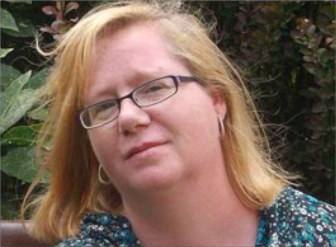 female wearing glasses smiling