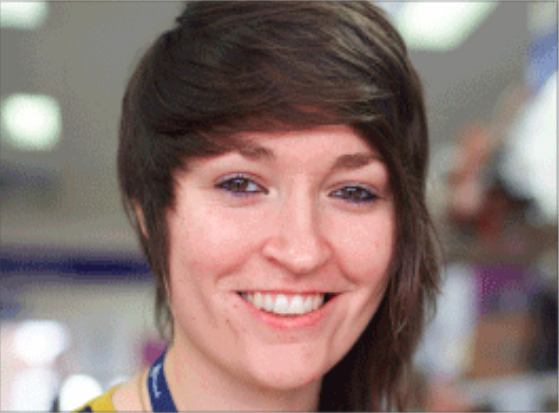 female with short hair smiling 