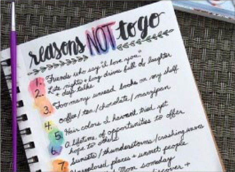 a notepad with colourful list of 'reasons not to go'