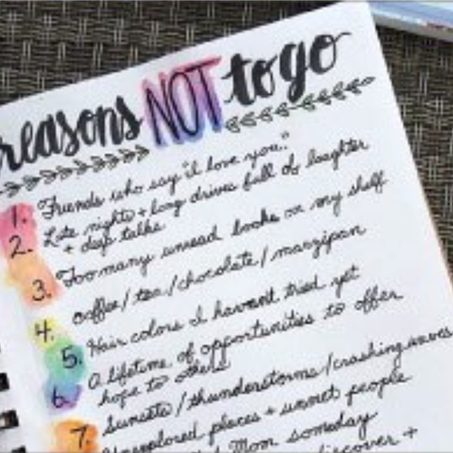 a notepad with colourful list of 'reasons not to go'