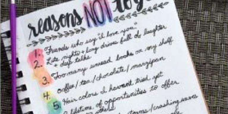 a notepad with colourful list of 'reasons not to go'