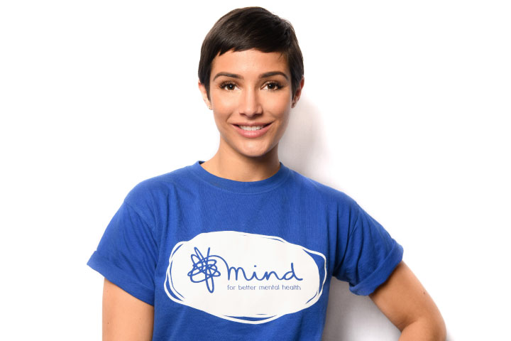 Frankie Bridge standing hand on hip smiling