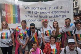 Mind staff at Pride in London 2019 with a banner that reads "we won't give up until all LGBTIQ+ people experiencing a mental health problem get support and respect."