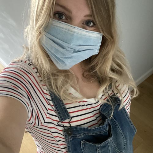 Samantha who's pregnant wearing a mask