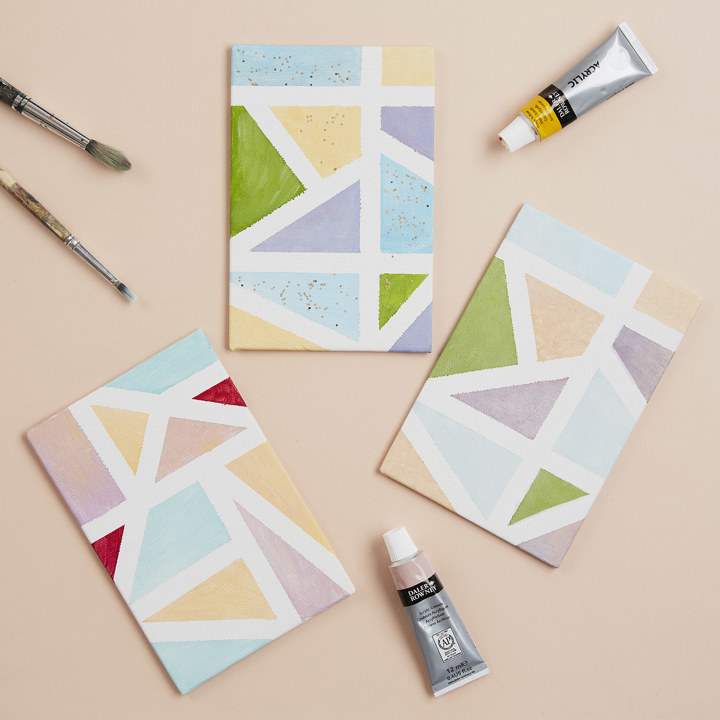 image showing small painted canvasses with geometric patterns