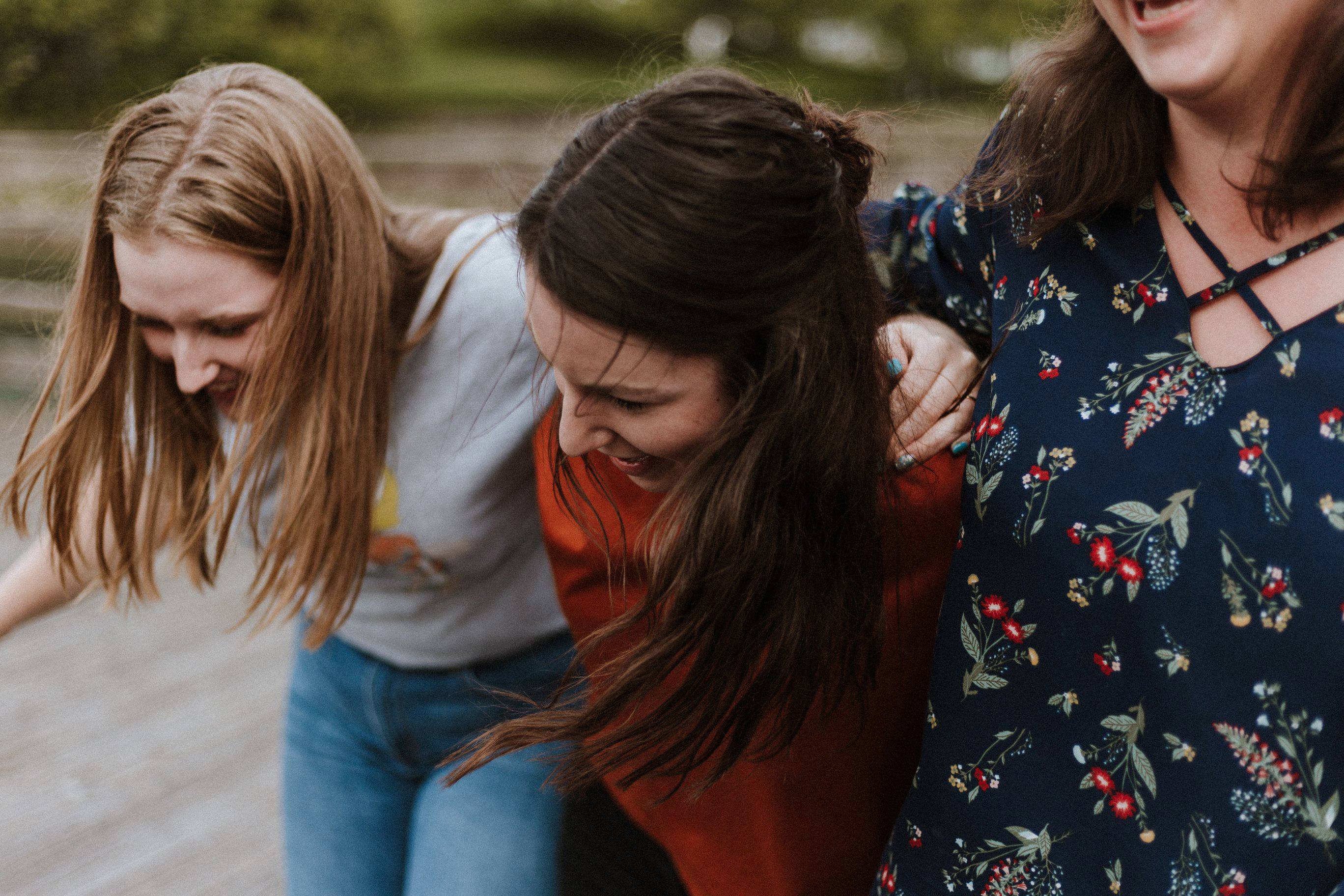 Three women laughing together