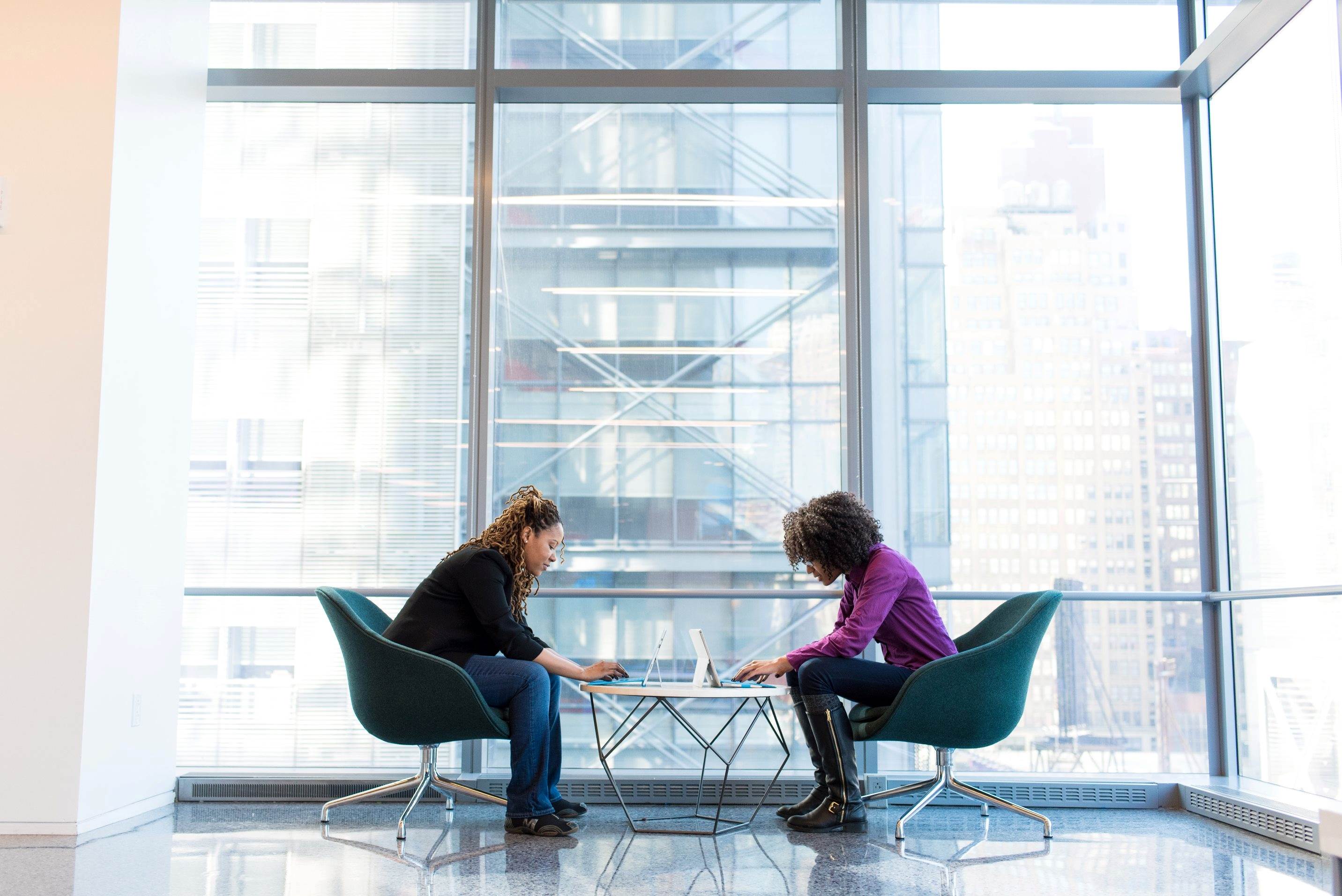 Two people at a large office window