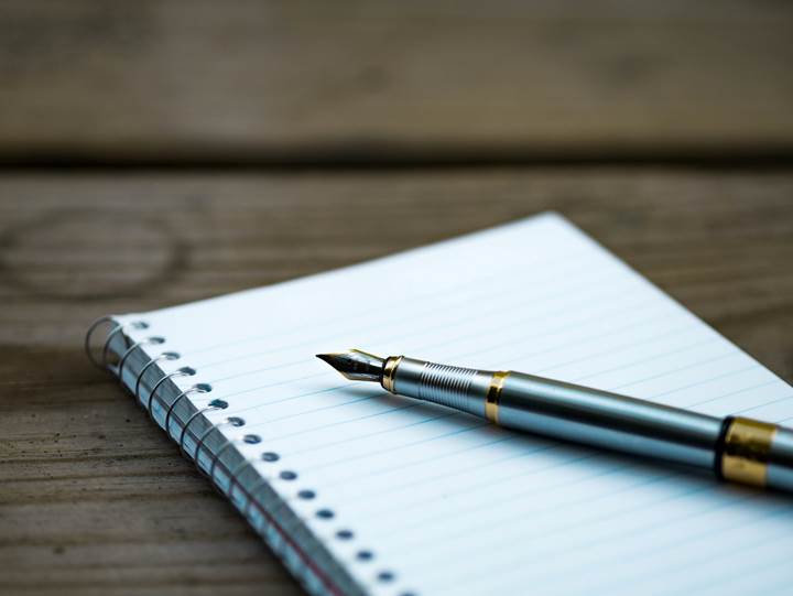 Pen on an empty notepad
