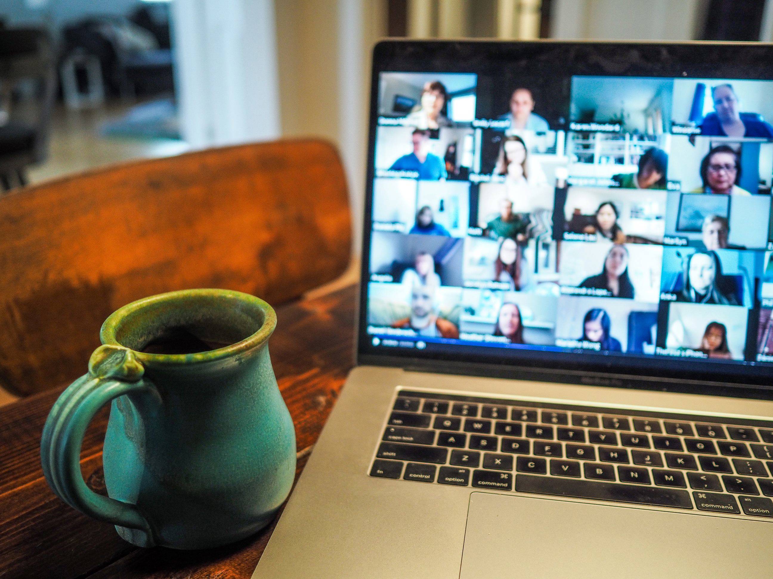 Laptop next to mug