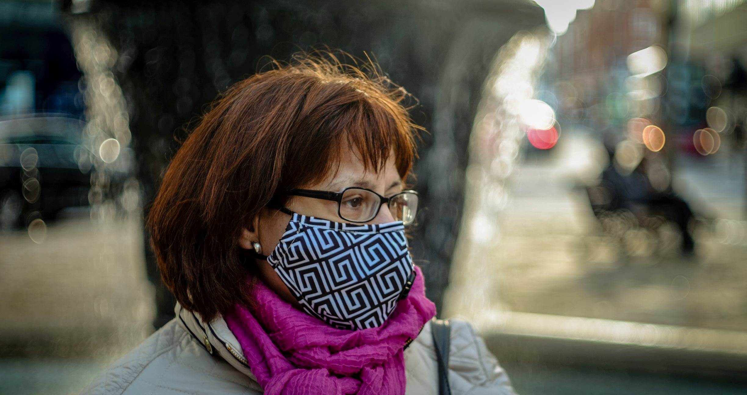Person wearing a mask and a scarf