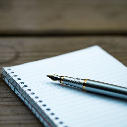 Pen on an empty notepad