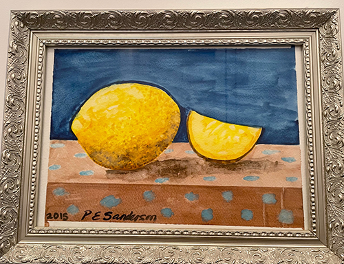This artwork shows 1 whole lemon and 1 lemon cut into a wedge on a brown surface with blue background.