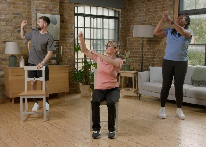 Three people in exercise class Three people in exercise class