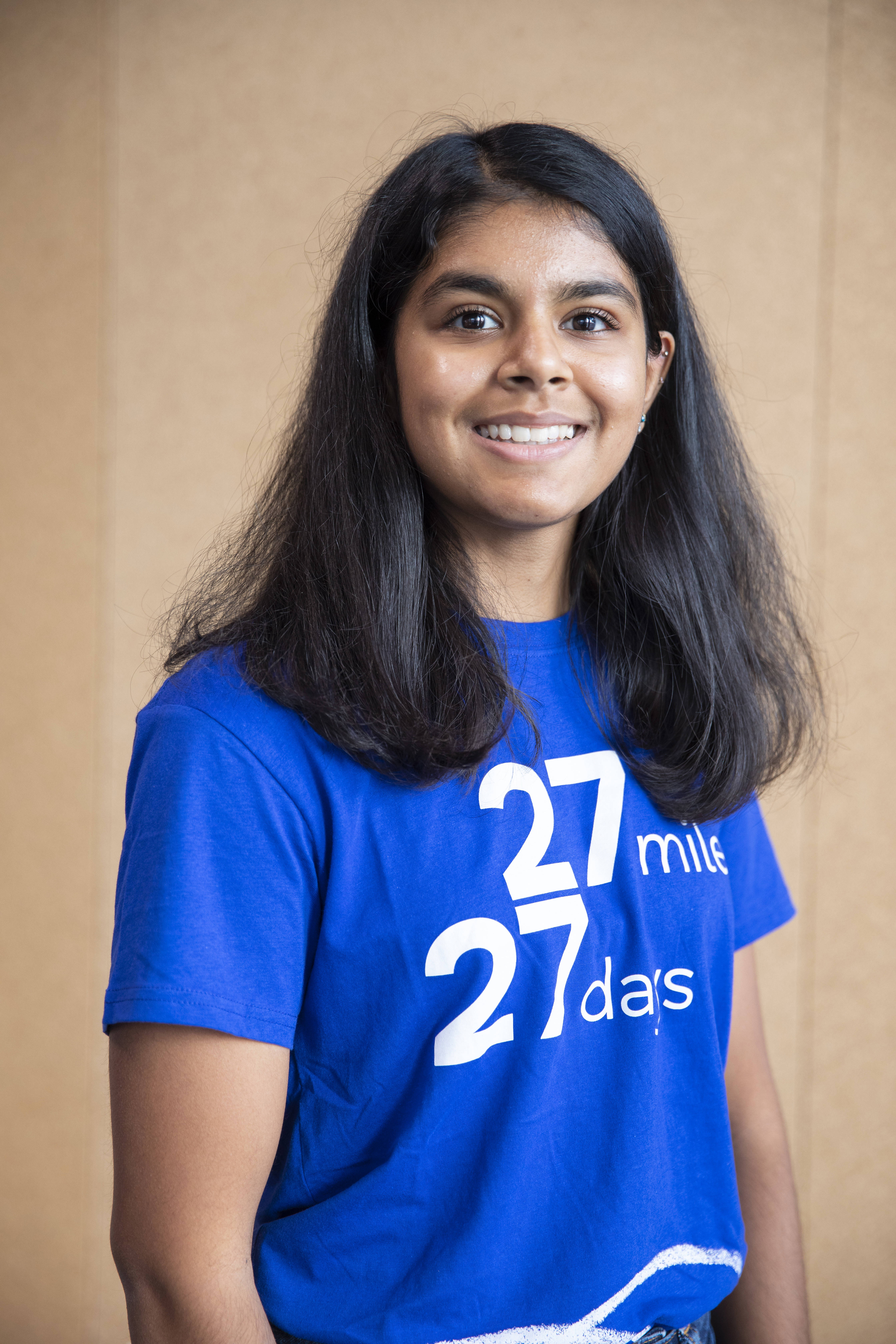 Person looking at the camera wearing a 27 27 t-shirt 