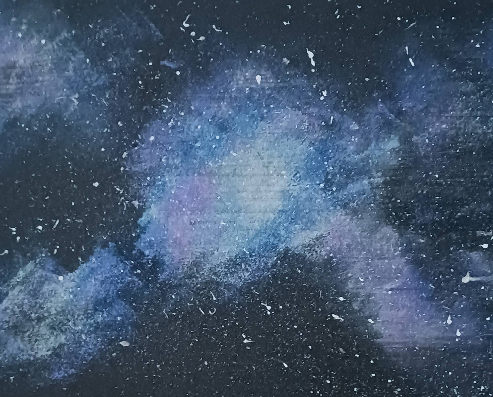A painting of a galaxy, with speckled white paint on a black, blue and violet background.