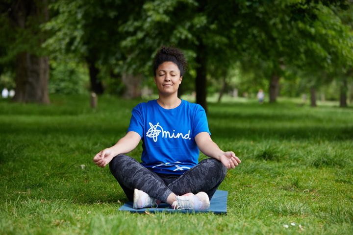 Woman doing yoga in the park